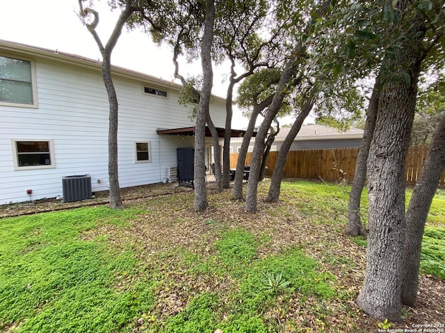 rear view of house with central AC