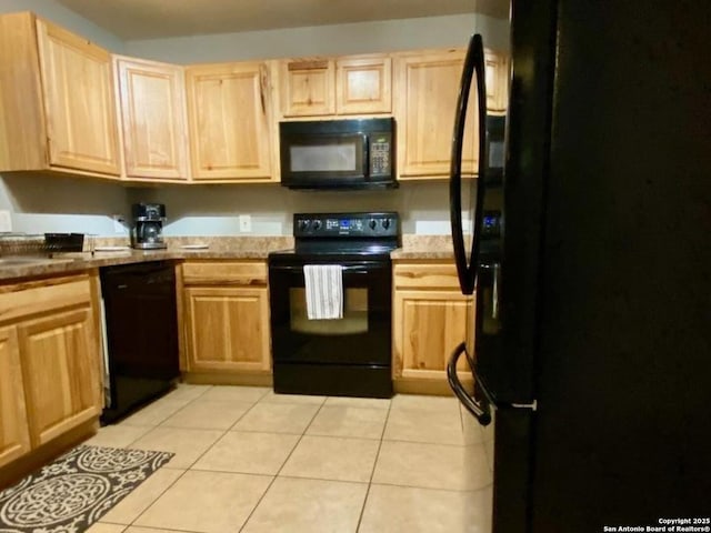 kitchen featuring black appliances, light brown cabinetry, and light tile patterned flooring