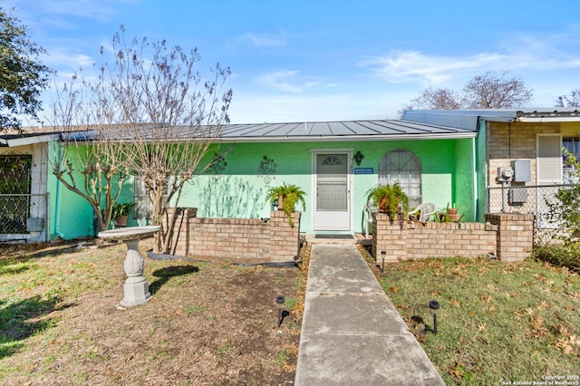 ranch-style house with a front yard