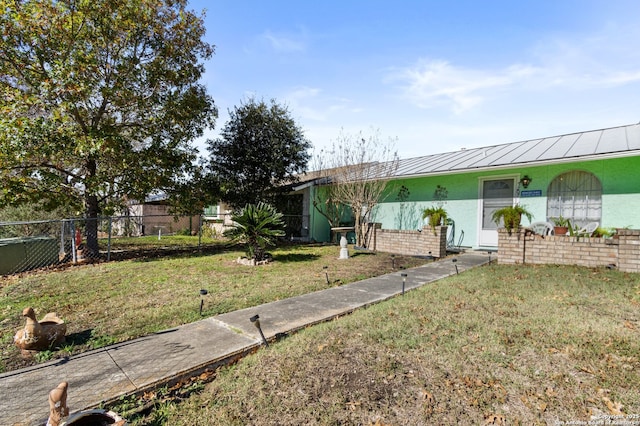 ranch-style house featuring a front lawn