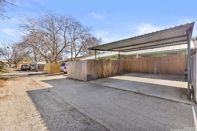 view of parking / parking lot with a carport