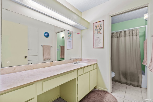 full bathroom featuring toilet, a textured ceiling, shower / bath combo with shower curtain, tile patterned floors, and vanity