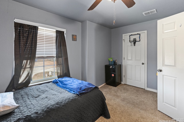 carpeted bedroom featuring ceiling fan