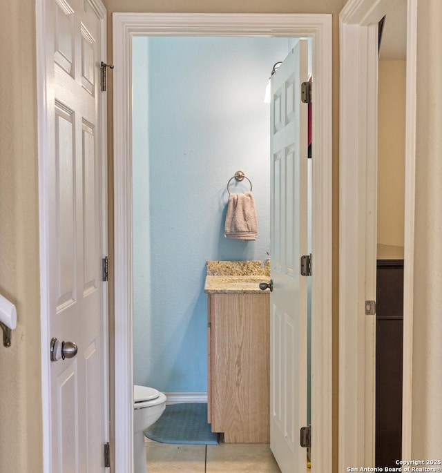 bathroom featuring tile patterned floors and toilet