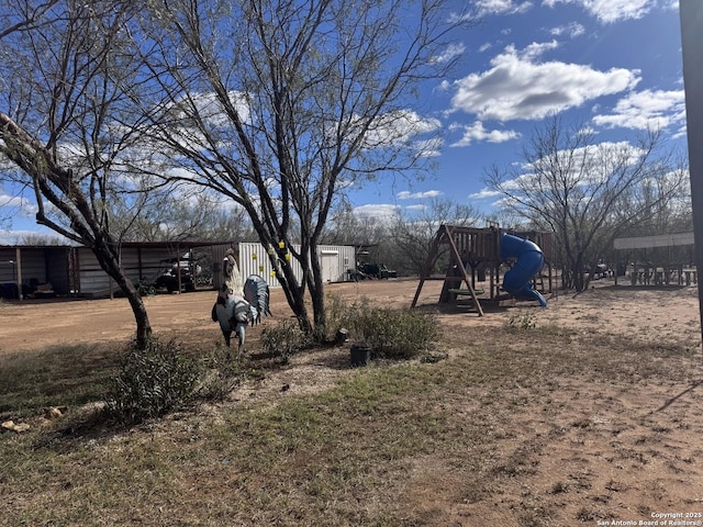 view of yard featuring a playground