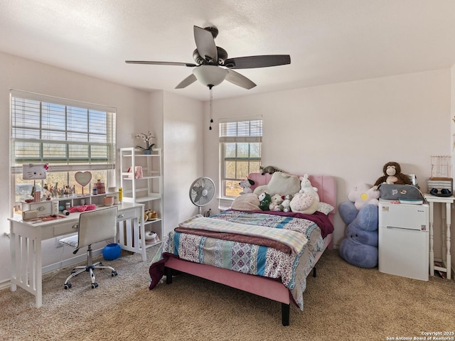 bedroom featuring ceiling fan and carpet flooring