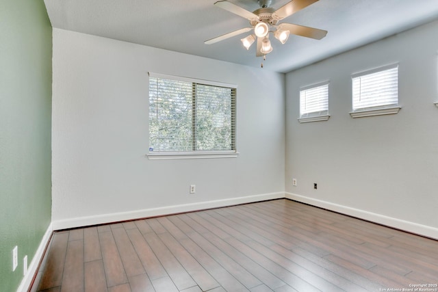 unfurnished room featuring ceiling fan and light hardwood / wood-style flooring