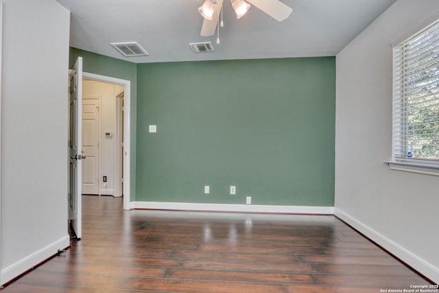 empty room featuring dark hardwood / wood-style floors and ceiling fan