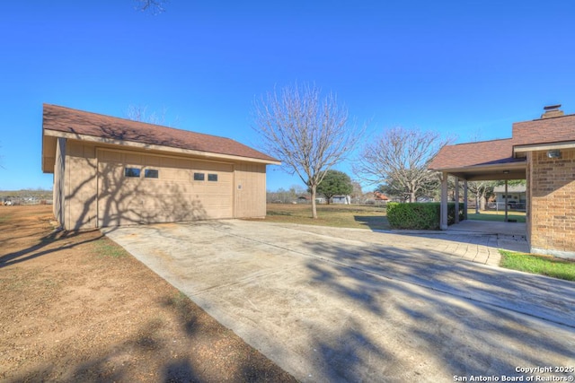 view of side of home with an outbuilding and a garage