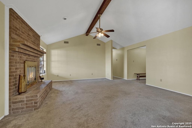 unfurnished living room with carpet, a fireplace, ceiling fan, and vaulted ceiling with beams