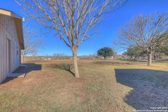 view of yard with a rural view