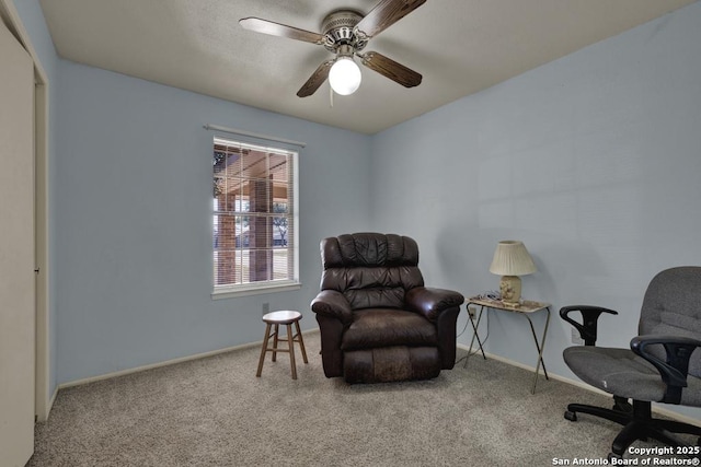 sitting room with carpet floors and ceiling fan