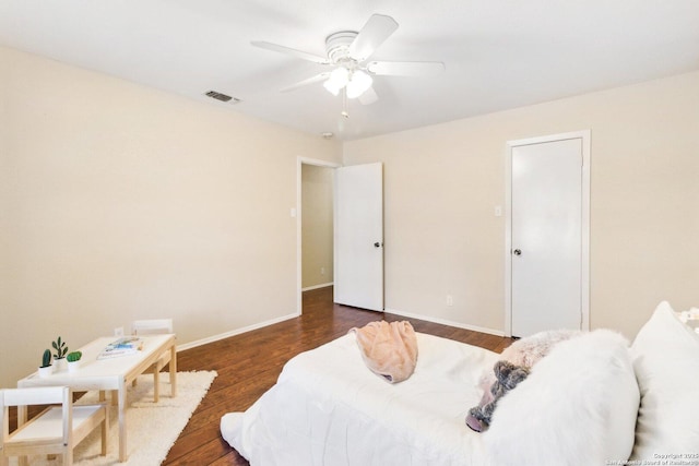 bedroom with ceiling fan and dark hardwood / wood-style flooring