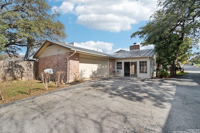 ranch-style home featuring a garage