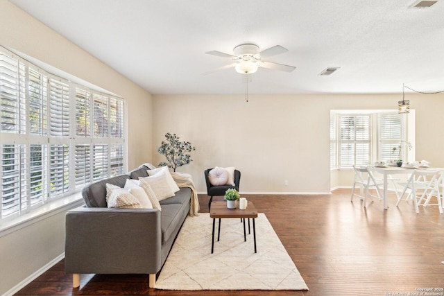 living room featuring ceiling fan and wood-type flooring