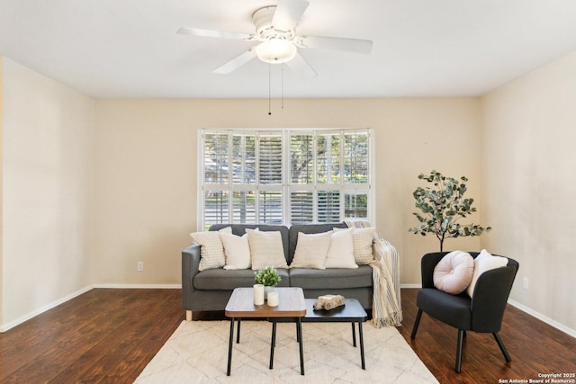 living room featuring ceiling fan and hardwood / wood-style floors