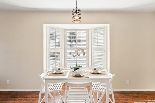 dining area featuring dark hardwood / wood-style flooring