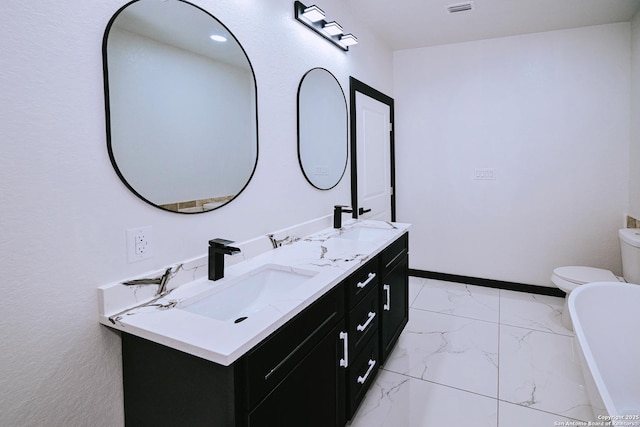 bathroom with toilet and vanity