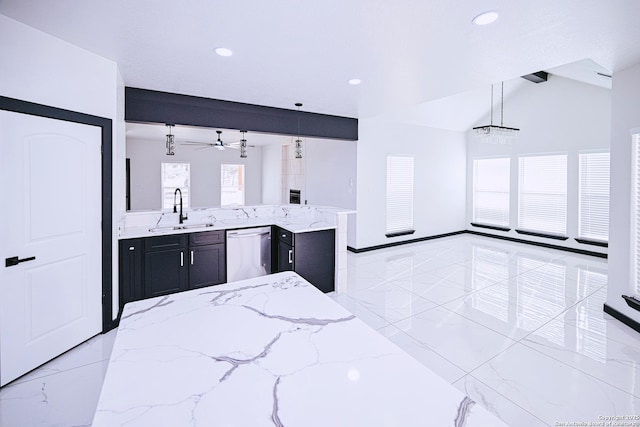 kitchen featuring sink, ceiling fan, hanging light fixtures, dishwashing machine, and plenty of natural light