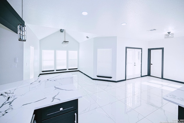 unfurnished living room with lofted ceiling