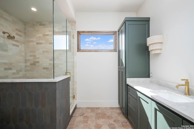 bathroom with vanity and a shower with shower door