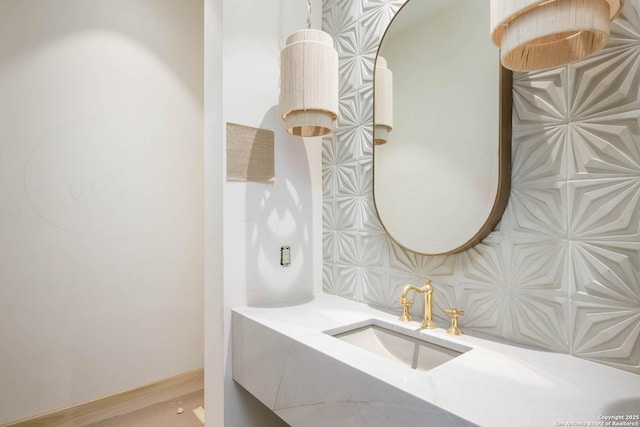 bathroom with vanity and backsplash