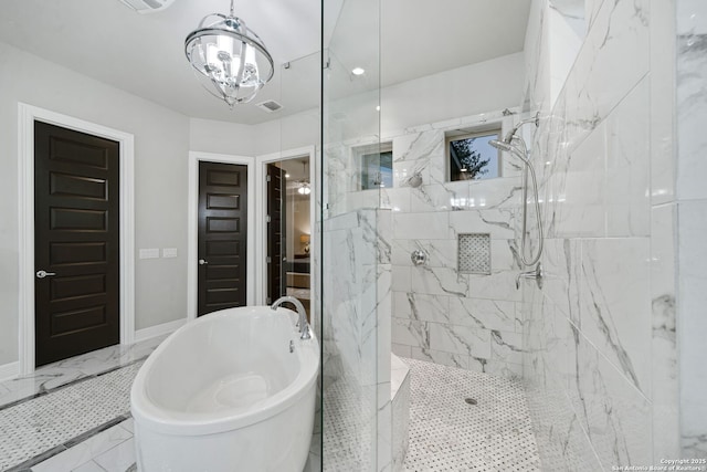 bathroom with plus walk in shower and a chandelier