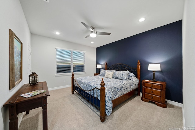 bedroom featuring light colored carpet and ceiling fan