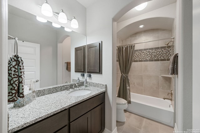 full bathroom featuring toilet, shower / tub combo, vanity, and tile patterned flooring