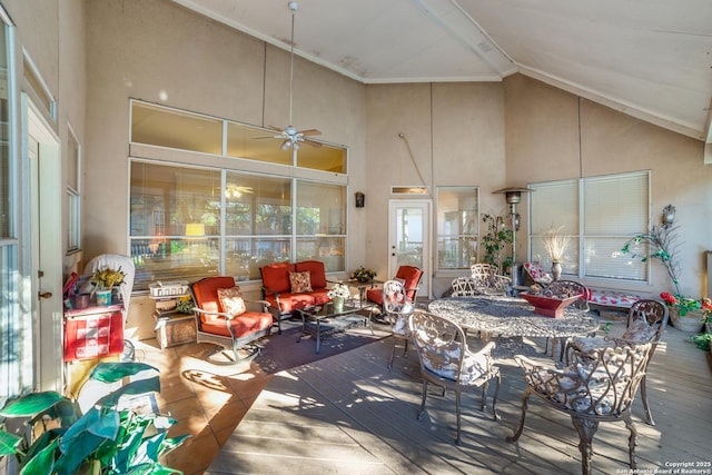 sunroom with vaulted ceiling and ceiling fan