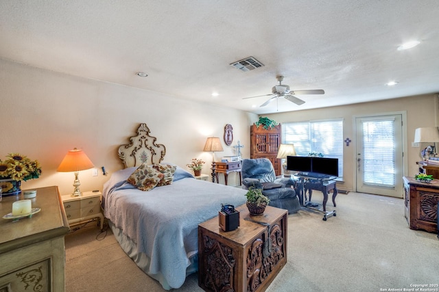 carpeted bedroom with ceiling fan, access to outside, and a textured ceiling