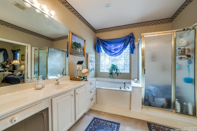 bathroom with independent shower and bath and vanity