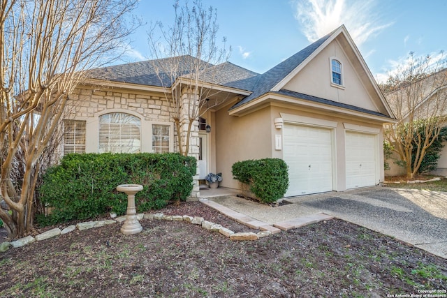 single story home featuring a garage