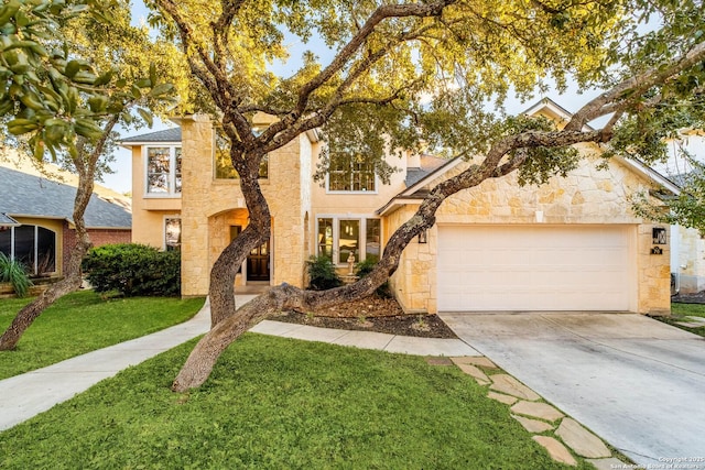 view of front of house with a garage and a front yard