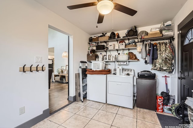 washroom with washing machine and clothes dryer, ceiling fan, and light tile patterned floors