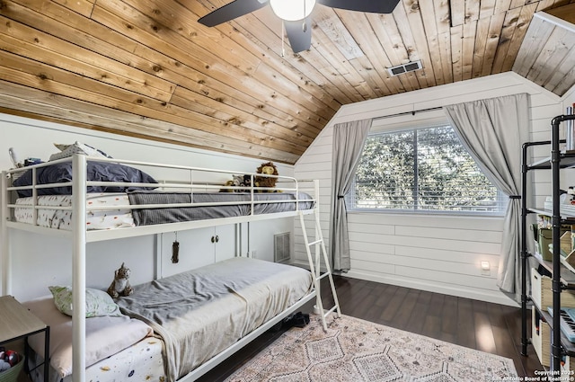 bedroom featuring wood ceiling, vaulted ceiling, ceiling fan, wooden walls, and hardwood / wood-style flooring