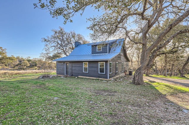 view of home's exterior with a yard