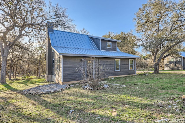 exterior space featuring a front lawn