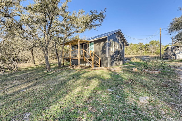 view of yard with a fire pit and a wooden deck