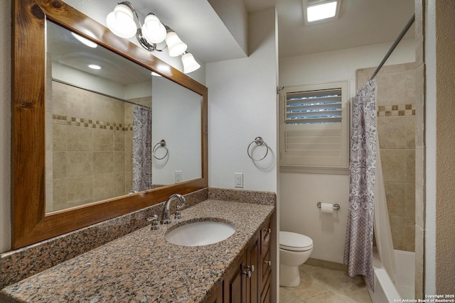 full bathroom with tile patterned floors, toilet, vanity, and shower / bath combo