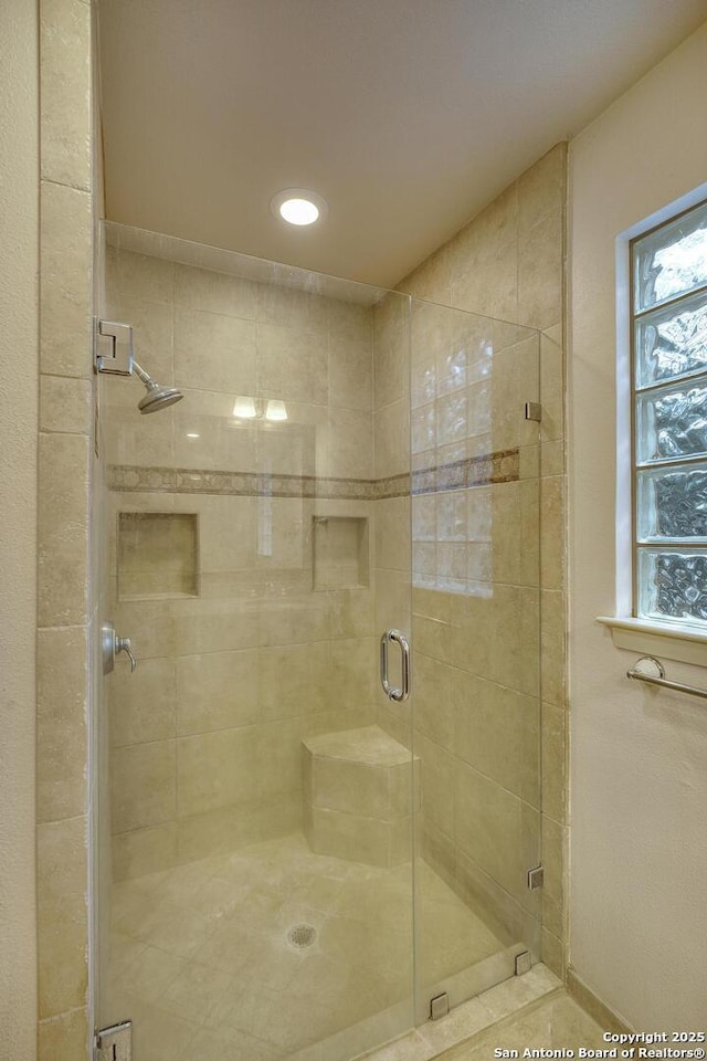 bathroom with an enclosed shower