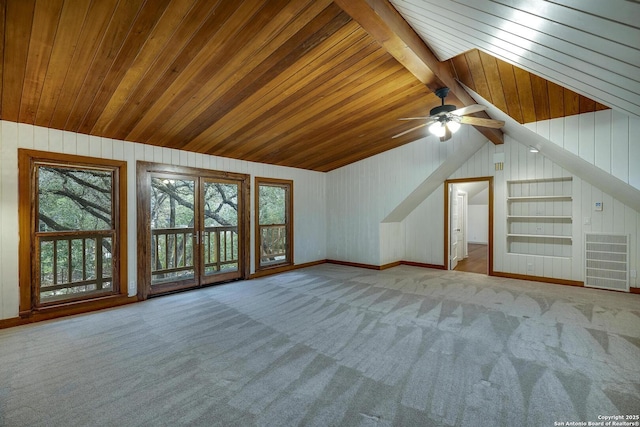 additional living space with lofted ceiling with beams, carpet flooring, and wood ceiling