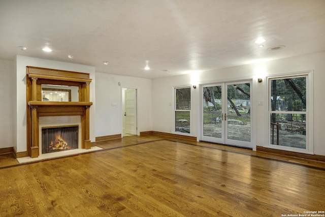 unfurnished living room featuring hardwood / wood-style floors