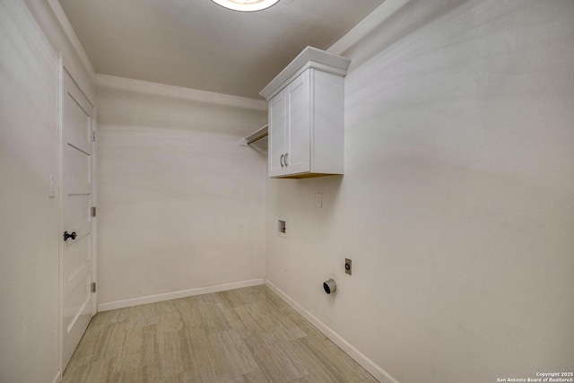 clothes washing area featuring cabinets, light hardwood / wood-style floors, hookup for a washing machine, and electric dryer hookup