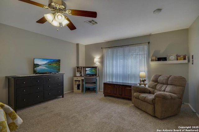 living area featuring ceiling fan and light carpet