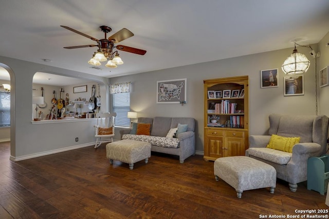 sitting room featuring ceiling fan and dark wood-type flooring