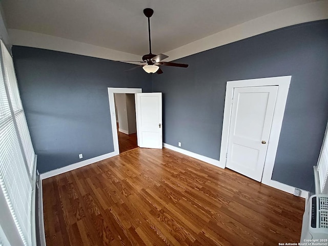 unfurnished bedroom featuring ceiling fan and wood-type flooring