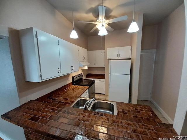 kitchen featuring white cabinetry, white fridge, sink, range with electric stovetop, and ceiling fan