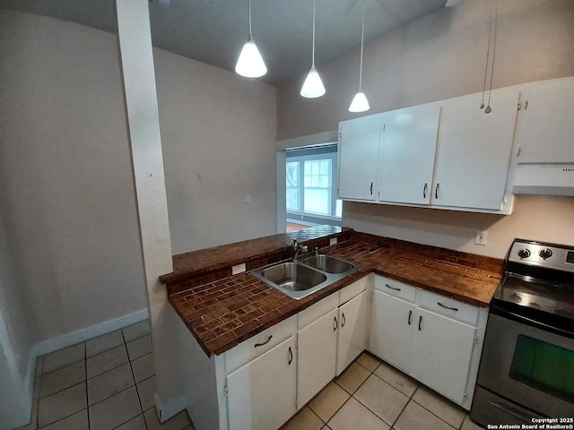 kitchen featuring white cabinetry, electric stove, sink, hanging light fixtures, and light tile patterned floors