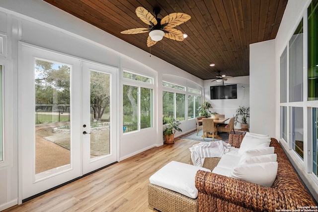 sunroom / solarium featuring ceiling fan, french doors, and wooden ceiling